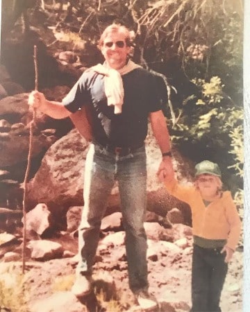 Childhood picture of Neil Hopkins with his father